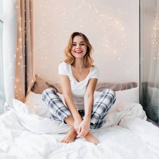 Sitting on bed wallpaper