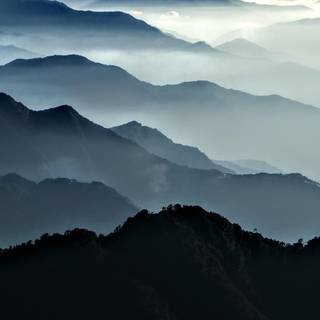 Foggy spring mountains wallpaper