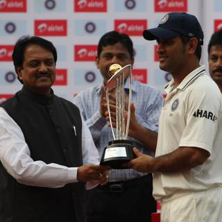 Ms Dhoni trophy wallpaper