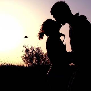 Boyfriend and girlfriend kisses wallpaper