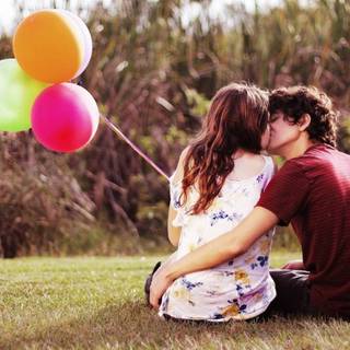 Boyfriend and girlfriend kisses wallpaper