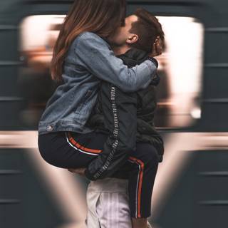Boyfriend and girlfriend kisses wallpaper
