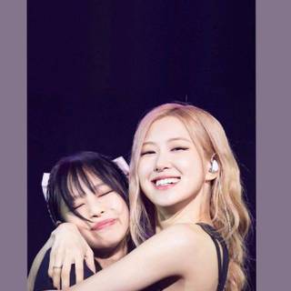 Jennie and Rose hug wallpaper