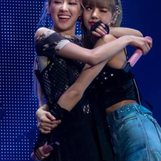 Jennie and Rose hug wallpaper