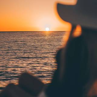 Watching sunset wallpaper