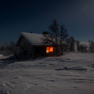 Winter night cabin wallpaper