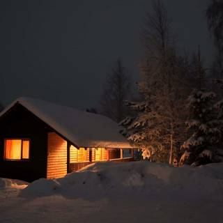 Winter night cabin wallpaper