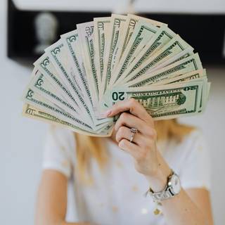 Girl with money wallpaper