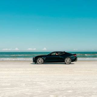 Car on beach wallpaper