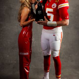 Mahomes holding Super Bowl LVIII trophy wallpaper