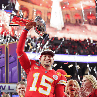 Mahomes holding Super Bowl LVIII trophy wallpaper