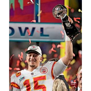 Mahomes holding Super Bowl LVIII trophy wallpaper