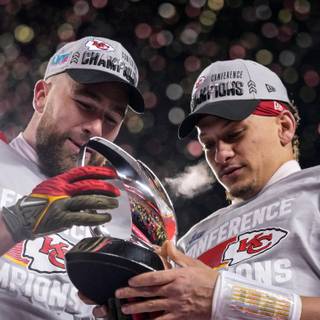 Mahomes holding Super Bowl LVIII trophy wallpaper