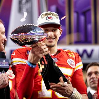 Mahomes holding Super Bowl LVIII trophy wallpaper