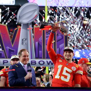 Mahomes holding Super Bowl LVIII trophy wallpaper