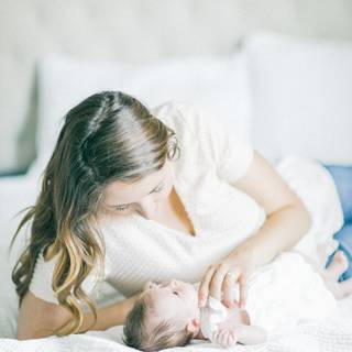 Mother and new born baby wallpaper