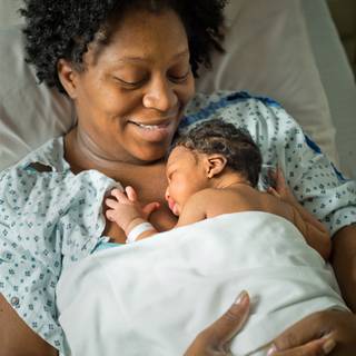 Mother and new born baby wallpaper