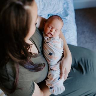 Mother and new born baby wallpaper