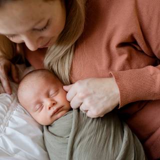 Mother and new born baby wallpaper