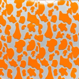 Orange cow print wallpaper