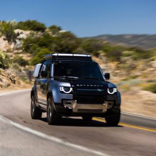 Convoy black Land Rover Defenders wallpaper