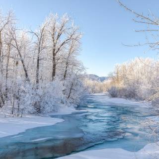 Snowy winter river wallpaper