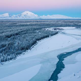Snowy winter river wallpaper