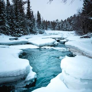 Snowy winter river wallpaper
