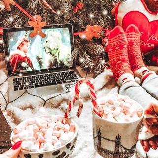 Hot cocoa and warm blankets cozy Christmas wallpaper