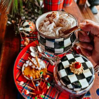 Hot cocoa and warm blankets cozy Christmas wallpaper