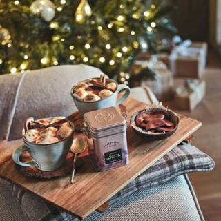 Hot cocoa and warm blankets cozy Christmas wallpaper