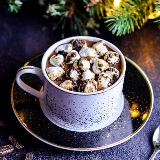 Hot cocoa and warm blankets cozy Christmas wallpaper