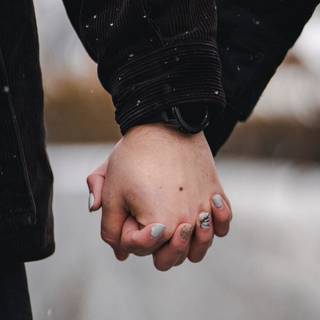 Couple holding hands wallpaper