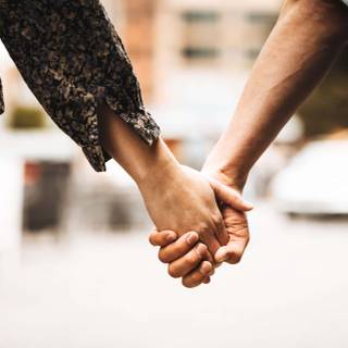 Couple holding hands wallpaper