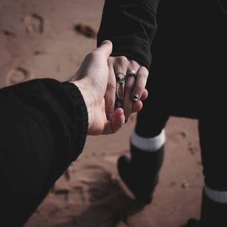 Couple holding hands wallpaper