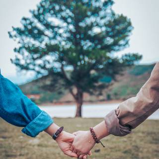 Couple holding hands wallpaper