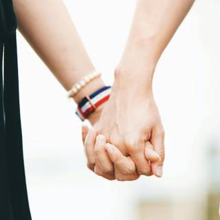 Couple holding hands wallpaper