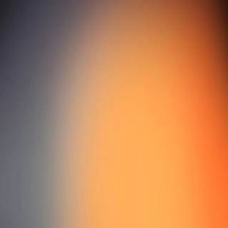 Orange fading to black wallpaper