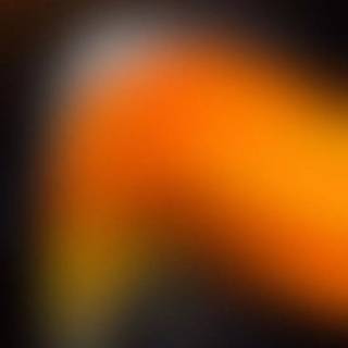 Orange fading to black wallpaper