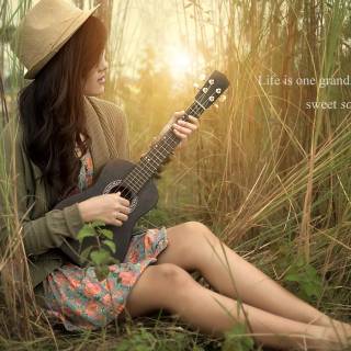 Girl playing guitar wallpaper