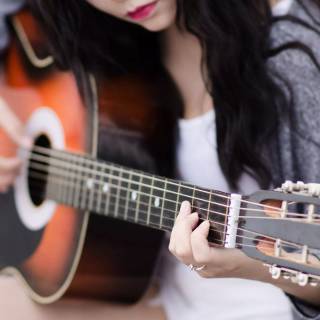 Girl playing guitar wallpaper