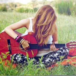 Girl playing guitar wallpaper