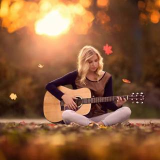Girl playing guitar wallpaper