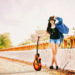 Girl playing guitar wallpaper
