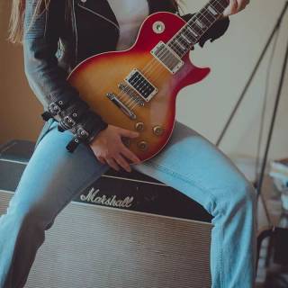 Girl playing guitar wallpaper