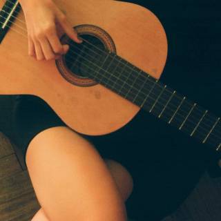 Girl playing guitar wallpaper
