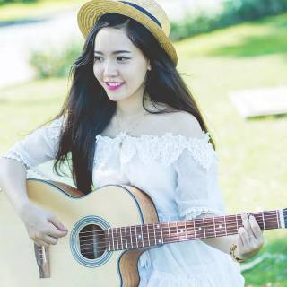 Girl playing guitar wallpaper