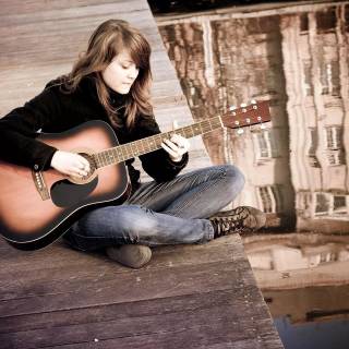 Girl playing guitar wallpaper