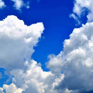 Fluffy clouds sky wallpaper