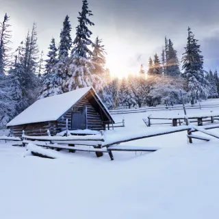 Snowy winter cabin wallpaper